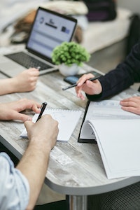 people sign documents-home